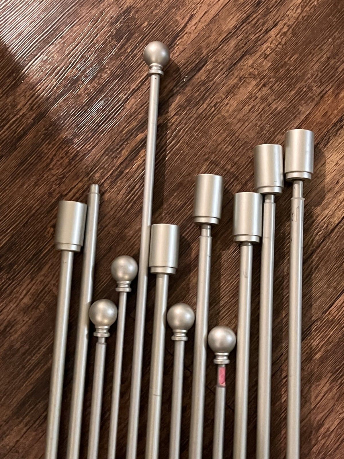 Lot of 11 brushed steel extendable curtain poles various sizes (see description)