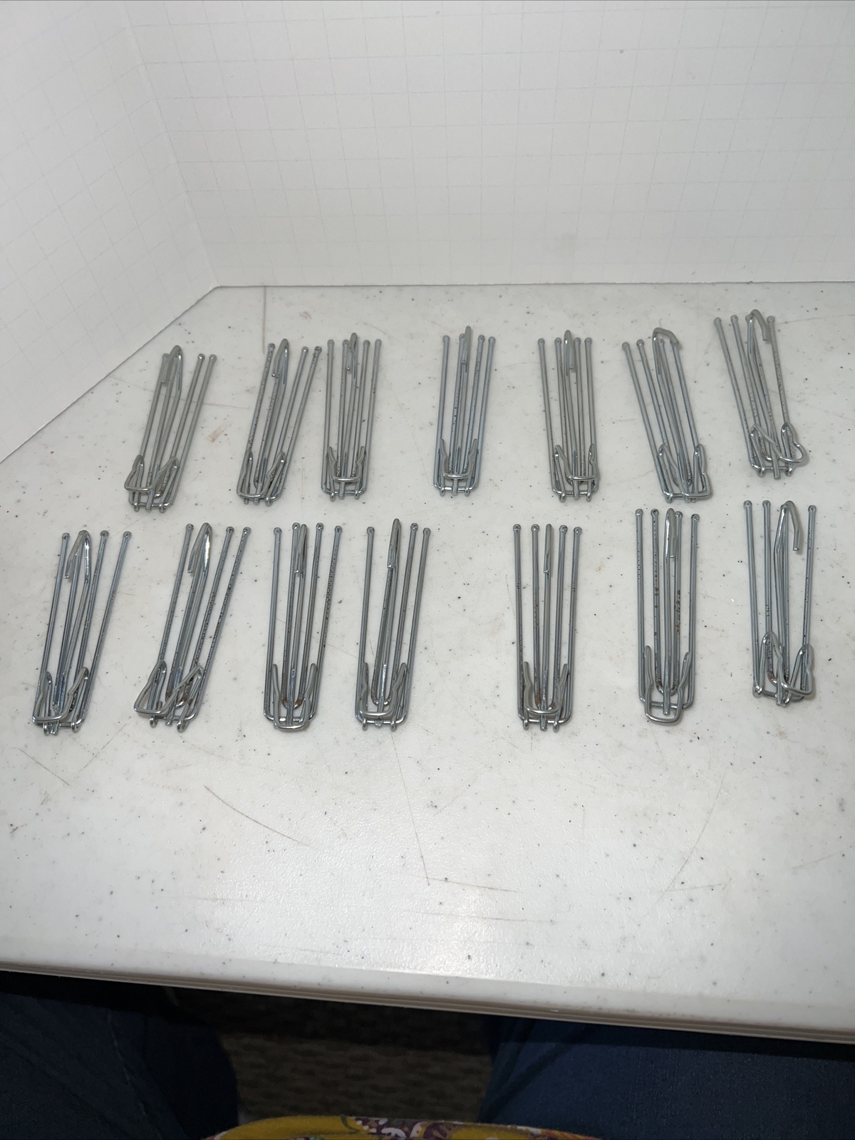 14 curtain hooks 4 prongs with extra hook on bottom.