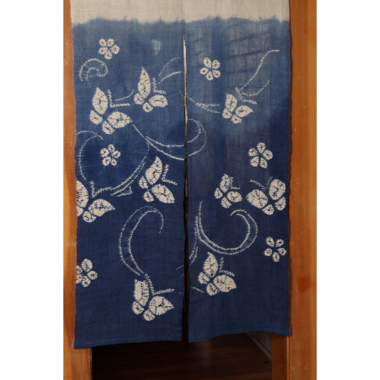 Butterfly and flower on blue