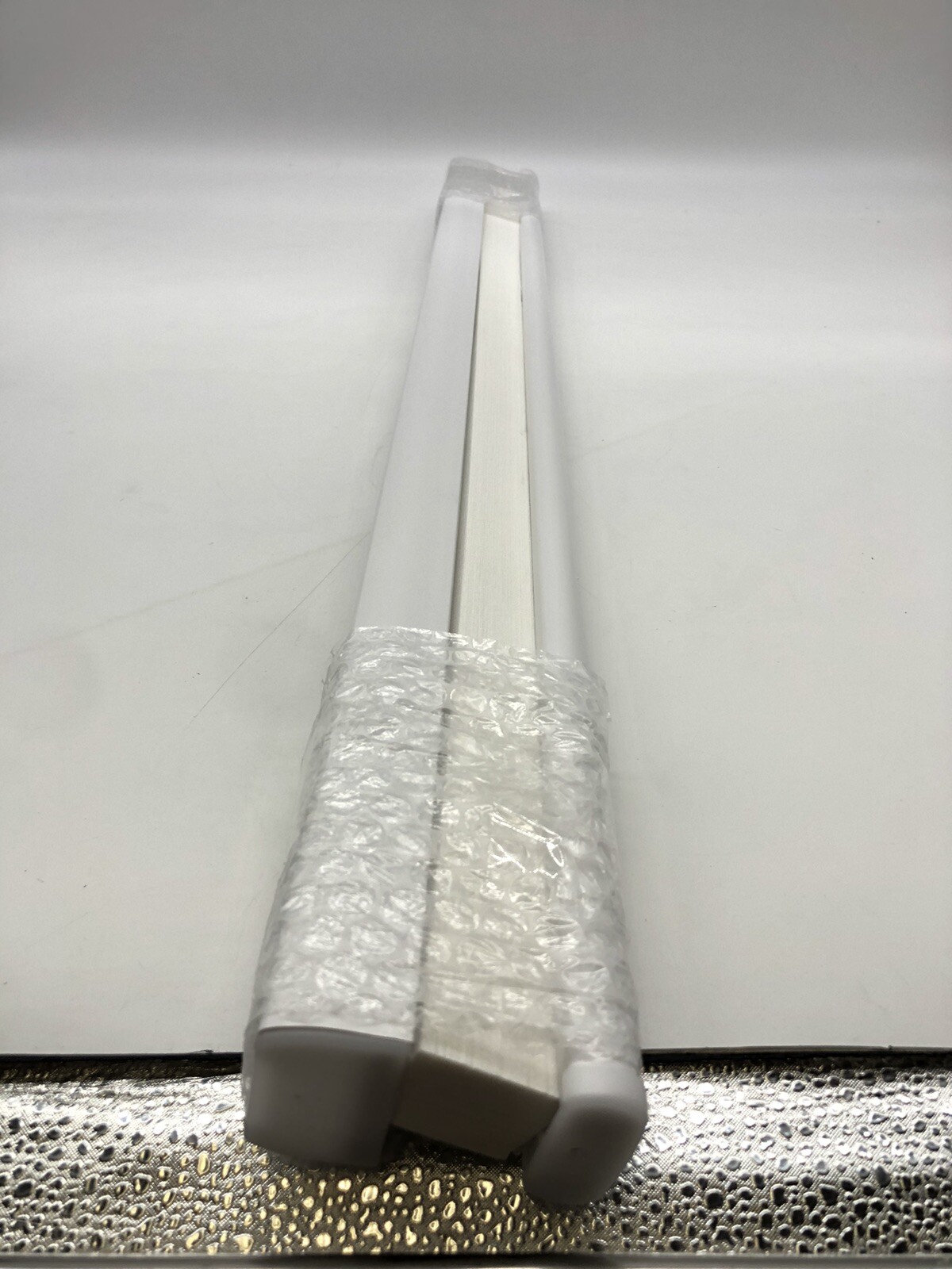 32.5 In x 64 In White Light Filtering Cordless Pleated Cellular shade.