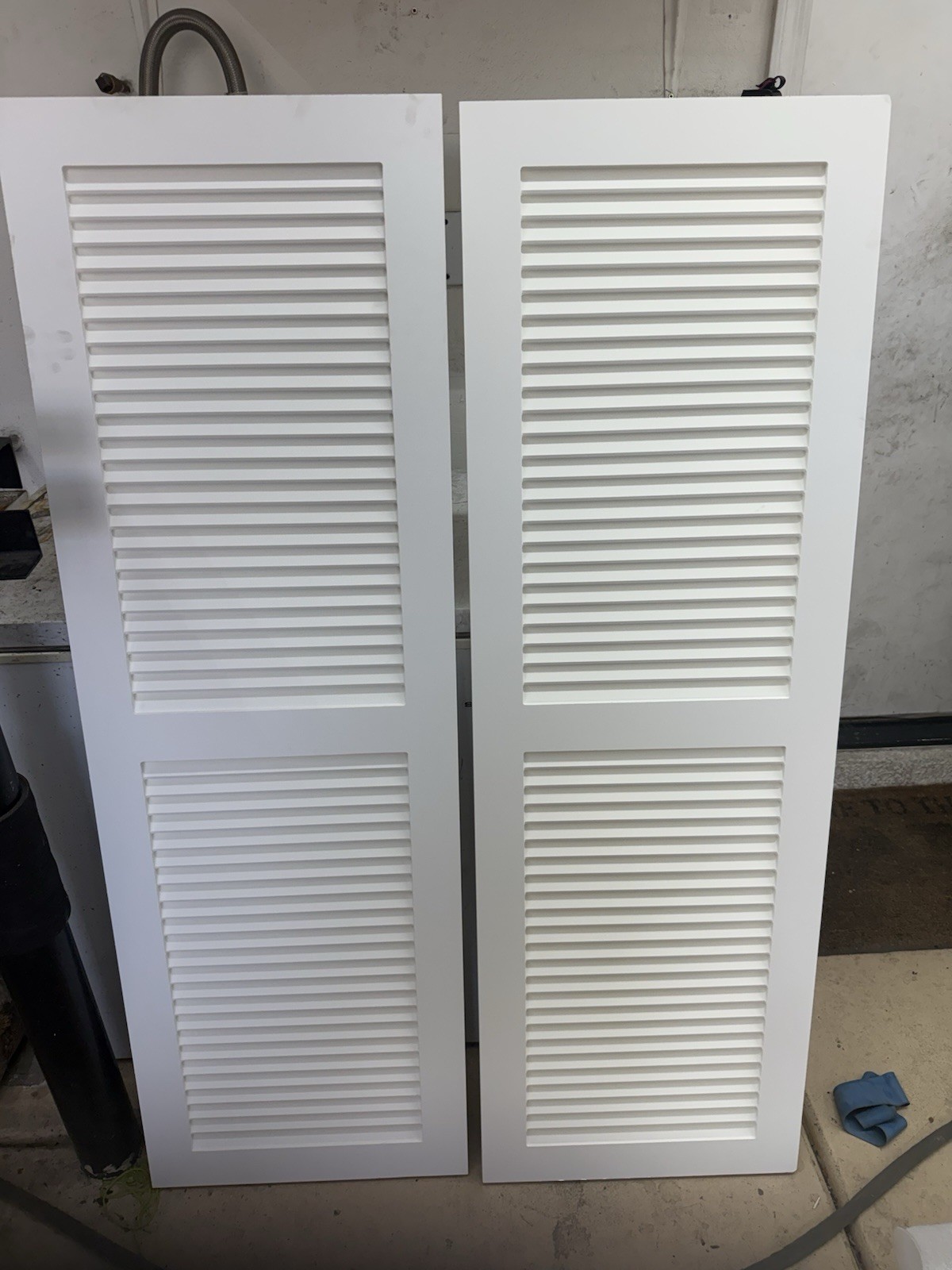 18 W x 55 H True Fit PVC Two Equal Louver Shutters Unfinished 2 Pack