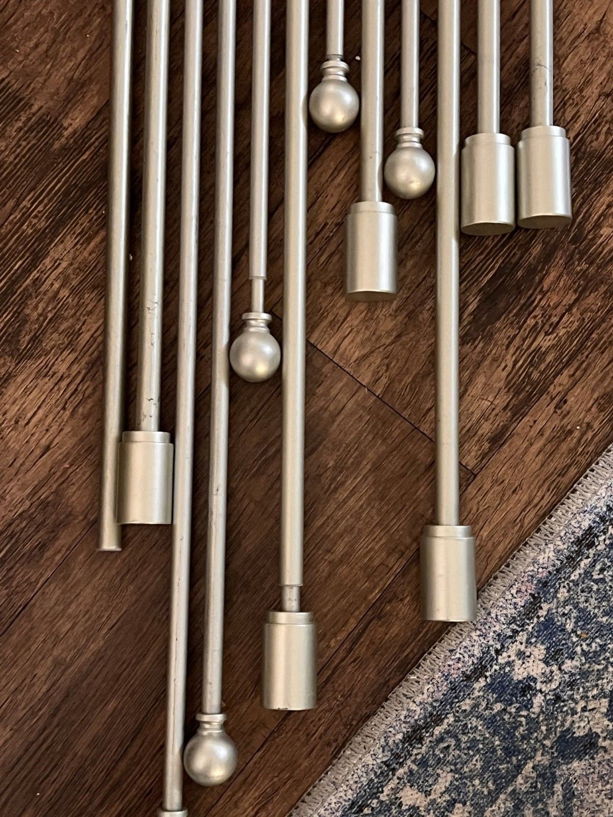 Lot of 11 brushed steel extendable curtain poles various sizes (see description)