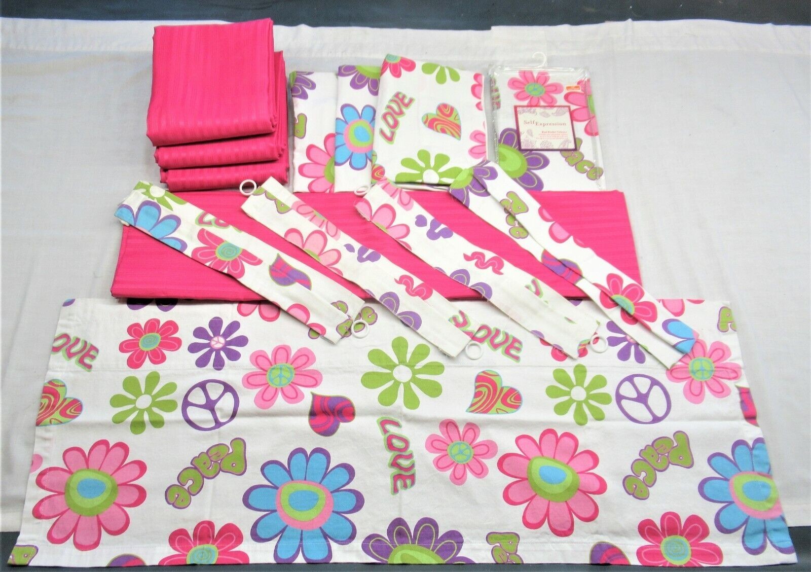 Pink room darkening 62″ curtains with matching peace sign valences and tie backs
