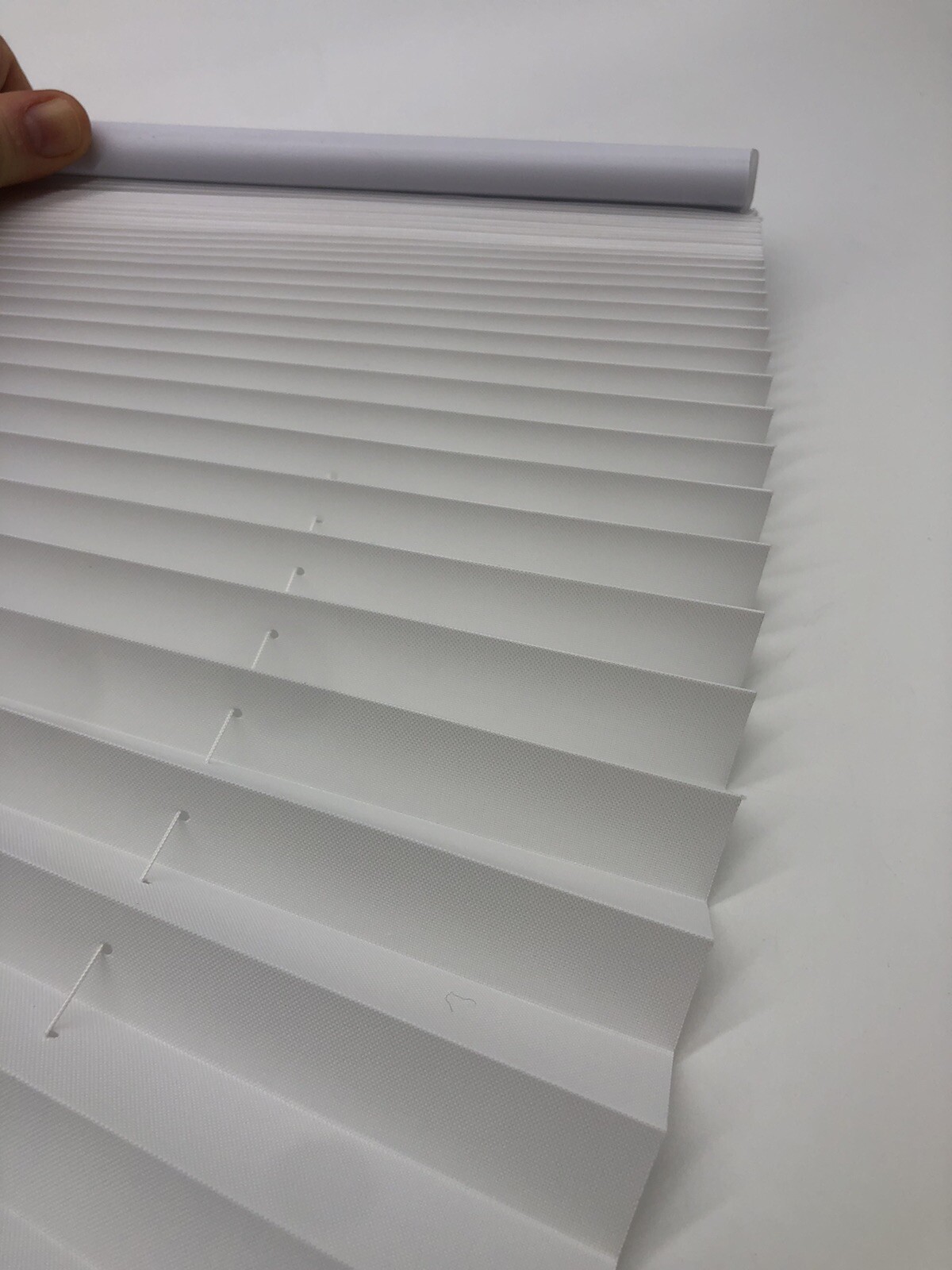 26in X 48in White Light Filtering Cordless Pleated Cellular shade.