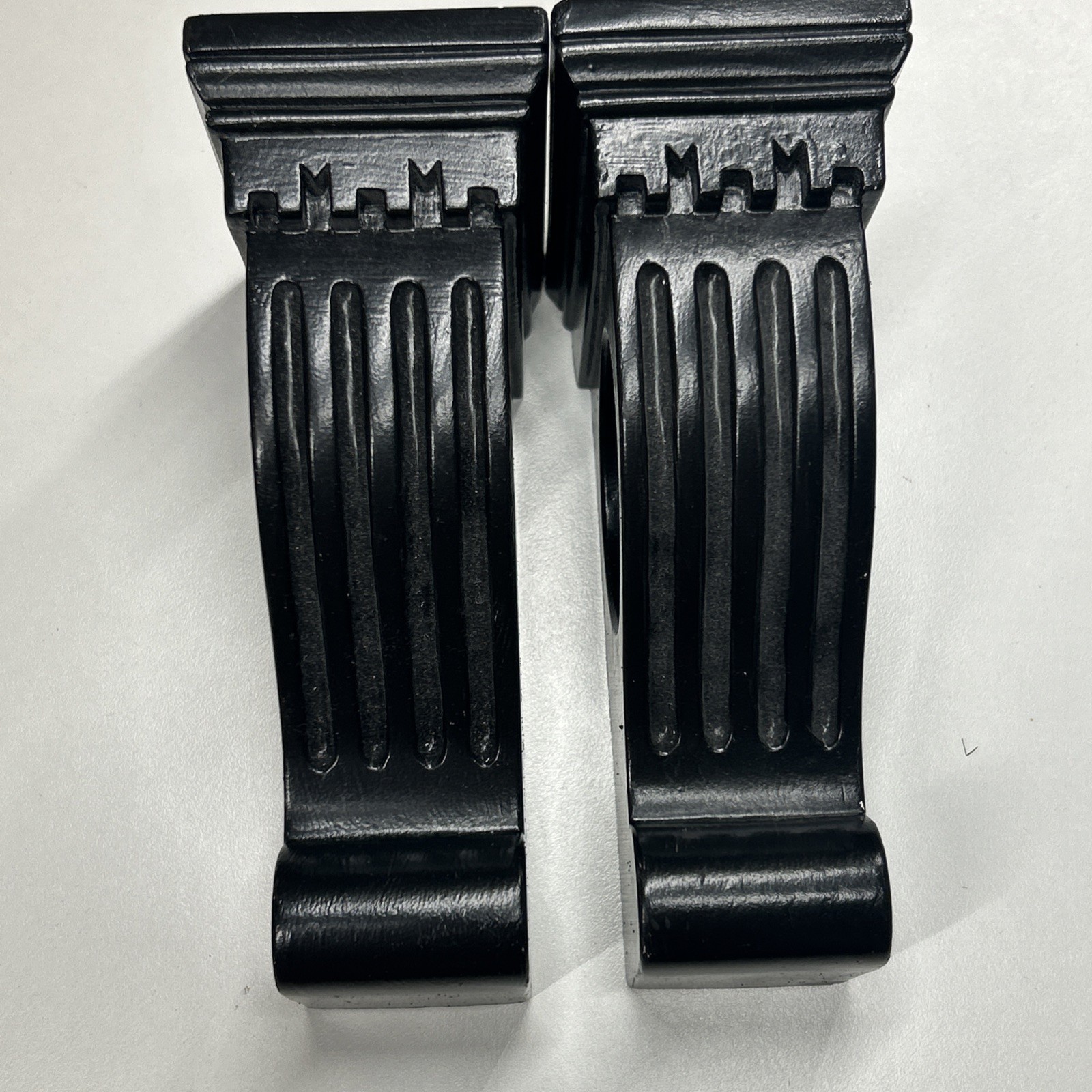 Black corbel-like curtain rod holders can also hold Scarf-style Window Treatment