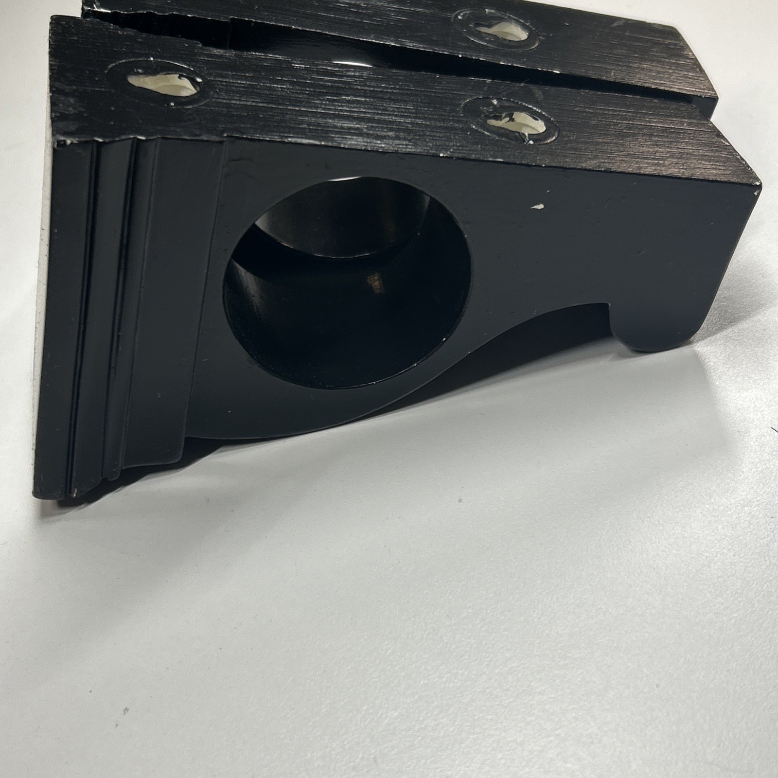 Black corbel-like curtain rod holders can also hold Scarf-style Window Treatment