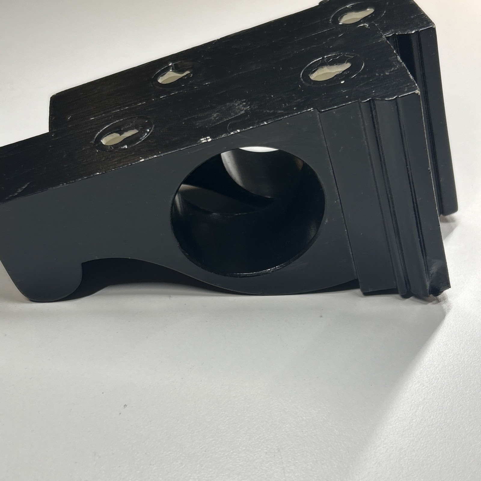 Black corbel-like curtain rod holders can also hold Scarf-style Window Treatment