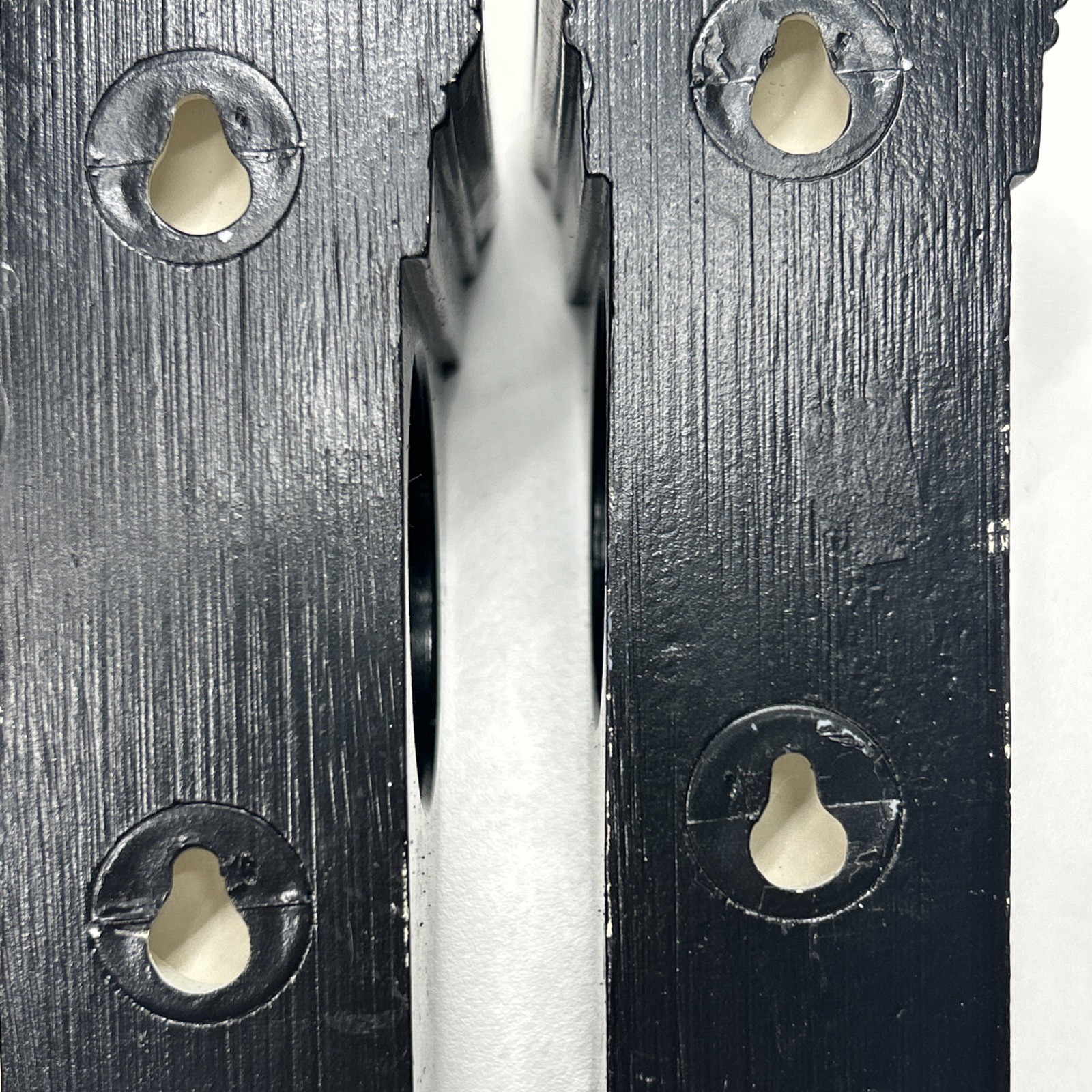 Black corbel-like curtain rod holders can also hold Scarf-style Window Treatment